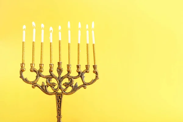 Religion image of jewish holiday Hanukkah background with menorah (traditional candelabra) and candles