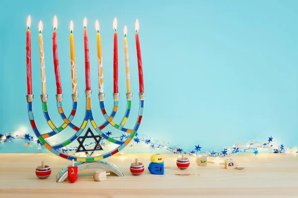 Religion image of jewish holiday Hanukkah background with menorah (traditional candelabra) and candles