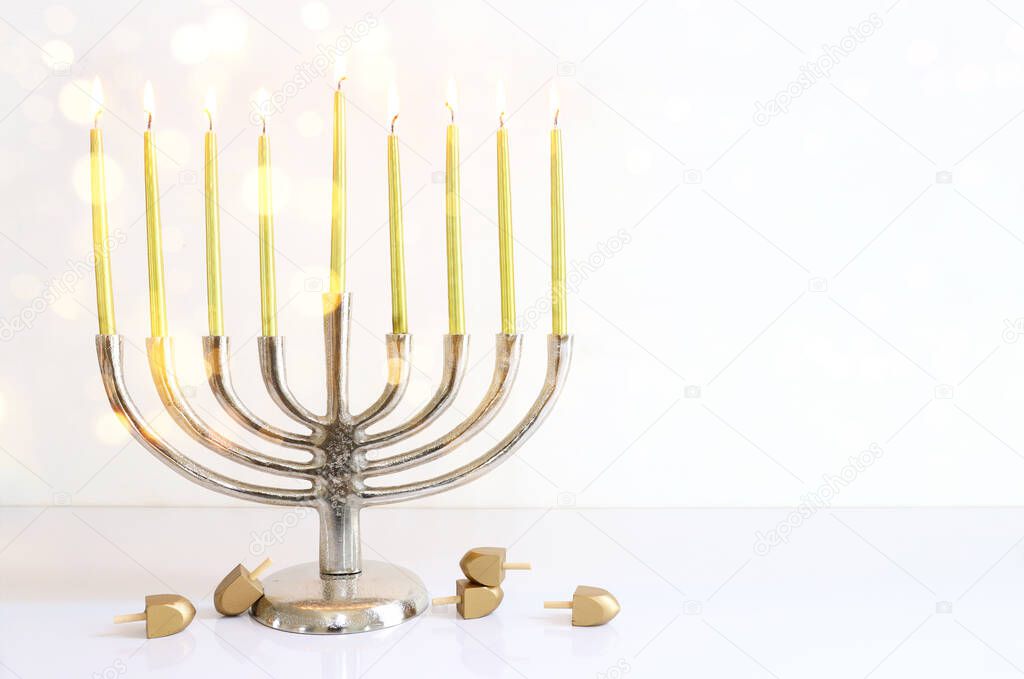 Religion image of jewish holiday Hanukkah background with menorah (traditional candelabra) and candles