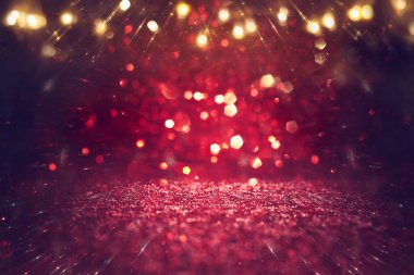 Soyut altın ve siyah parıltılı ışıkların arkaplanı. Odaklanamadı