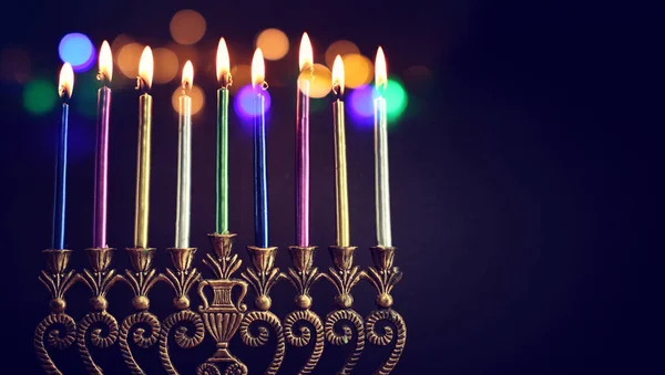 Religion image of jewish holiday Hanukkah background with menorah (traditional candelabra) and candles