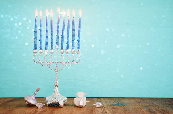 Religion image of jewish holiday Hanukkah background with menorah (traditional candelabra) and candles