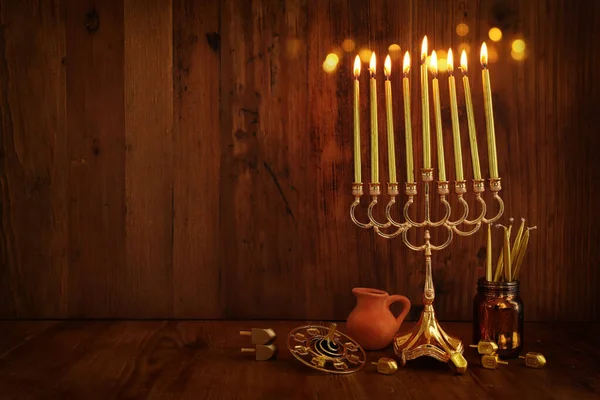 Religion image of jewish holiday Hanukkah background with menorah (traditional candelabra) and candles