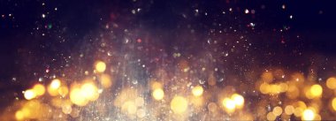 Soyut parıltılı ışıkların arkaplanı. Gümüş, altın ve siyah. & Odaklan