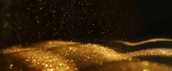 Hintergrund Aus Abstraktem Gold Und Schwarzen Glitzerlichtern Defokussiert — Stockfoto