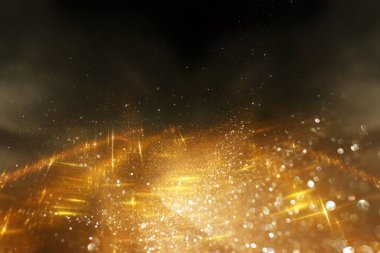 Soyut altın ve siyah parıltılı ışıkların arkaplanı. Odaklanamadı