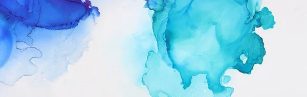 art photography of abstract fluid painting with alcohol ink, blue and gold colors