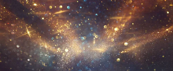 Background Abstract Glitter Lights Gold Blue Black Focused — Stock Photo, Image