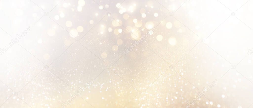 abstract glitter silver and gild lights background. de-focused