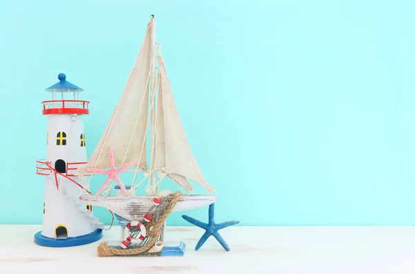 Nautical Concept White Decorative Sail Boat Seashells Wooden Table Blue — 스톡 사진