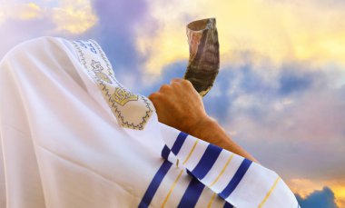 Jewish man blowing the Shofar (horn) of Rosh Hashanah (New Year). Religious symbol clipart