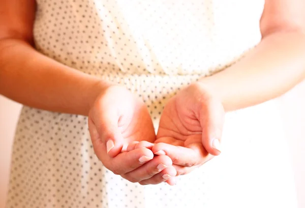 Closeup of young woman hands. hands outstreched in cupped shape — Stock Photo, Image