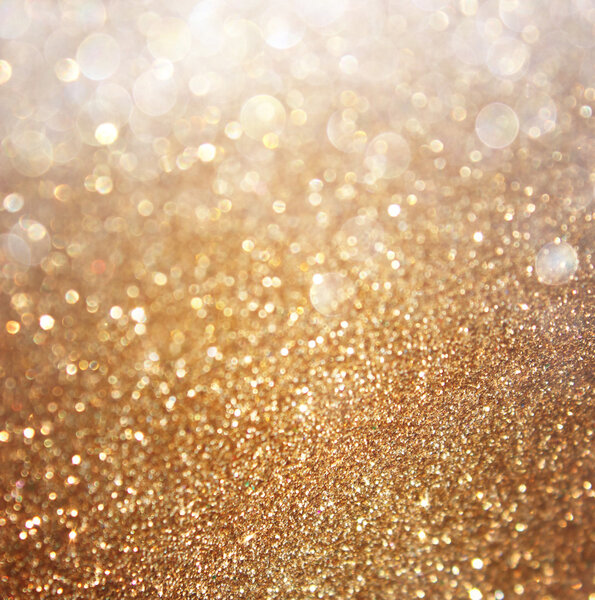 Abstract gold background with copy space . gliiter bokeh lights