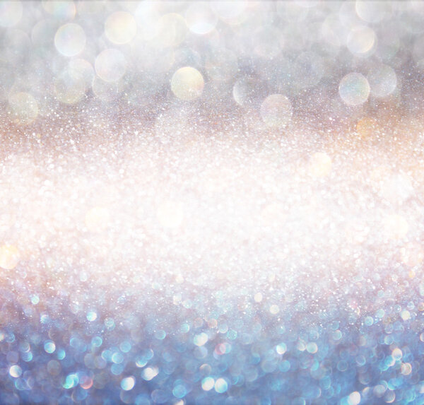 Bokeh lights background with multi layers and colors of white silver and blue