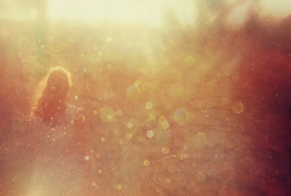 Surreal photo of young woman standing in forest. image is textured and toned — Stock Photo, Image