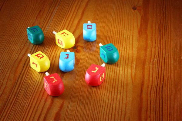 Wooden dreidels for hanukkah on wooden table
