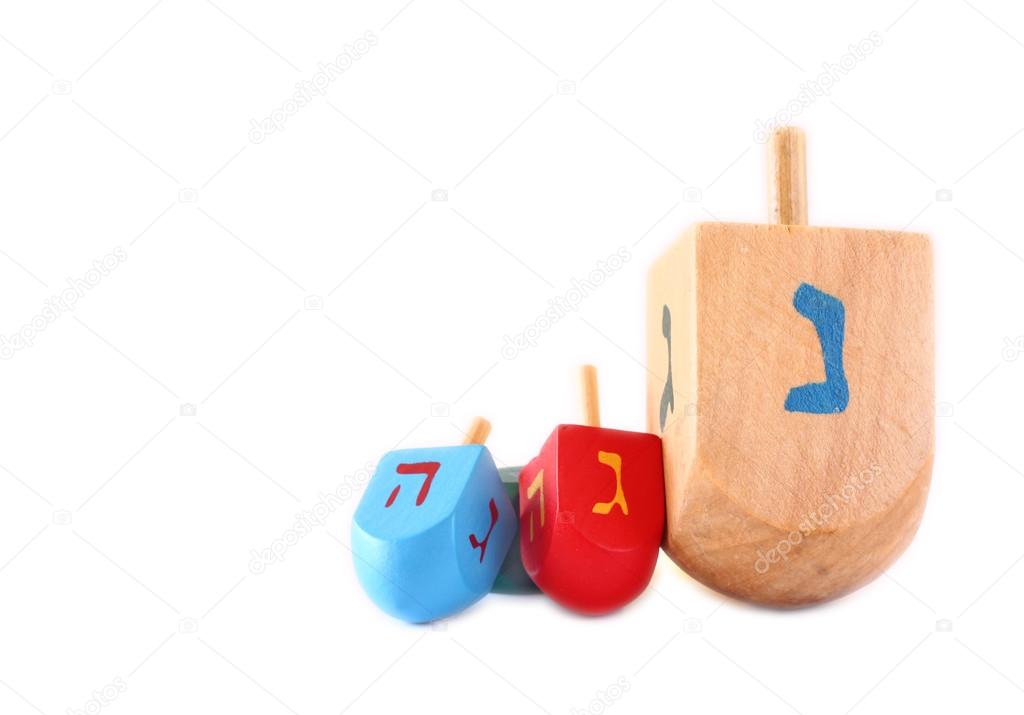 Wooden dreidels for hanukkah isolated on white background