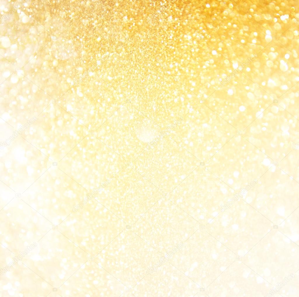 Glitter vintage lights background. abstract gold background . defocused