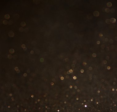 Glitter vintage ışıklar arka plan. ışık altın rengi ve siyah. defocused.