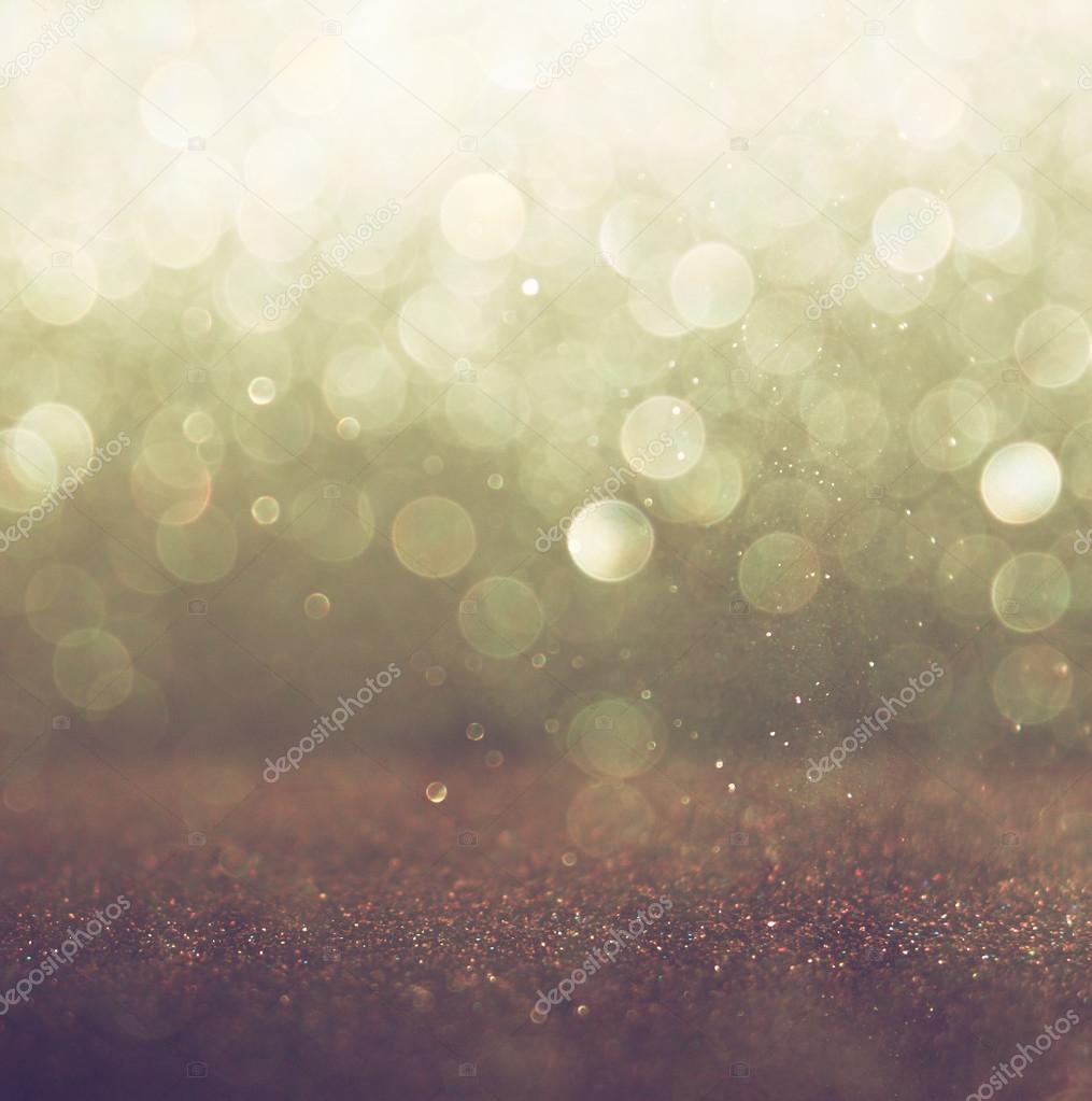 Glitter vintage lights background. light gold and black. defocused.