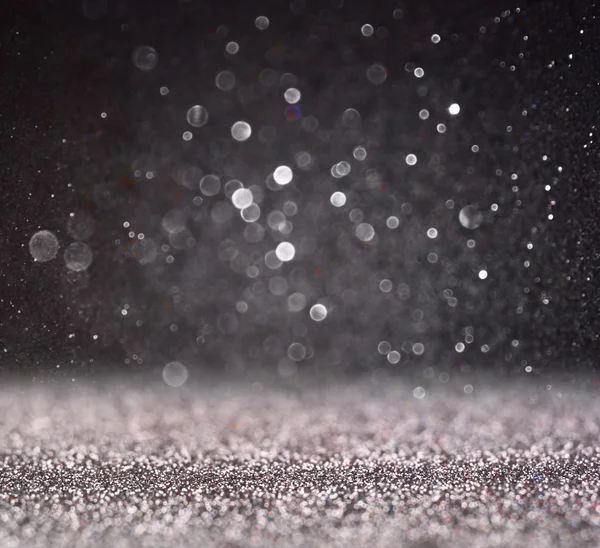 Glitter vintage ışıklar arka plan. Gümüş ve siyah. defocused.