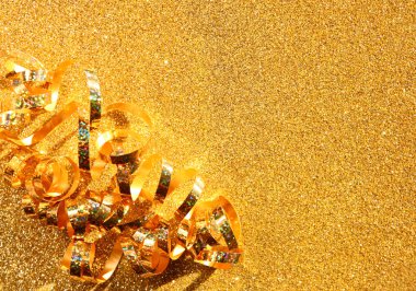 Kıvırcık altın şerit üzerinde dokulu glitter arka plan görüntüsünü Üstten Görünüm