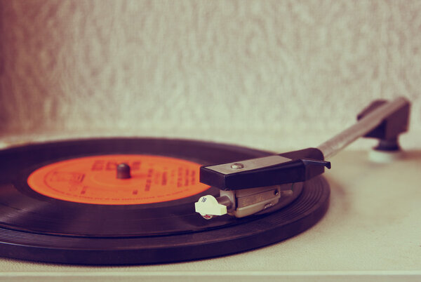 Image of old record player, image is retro filtered . selective focus