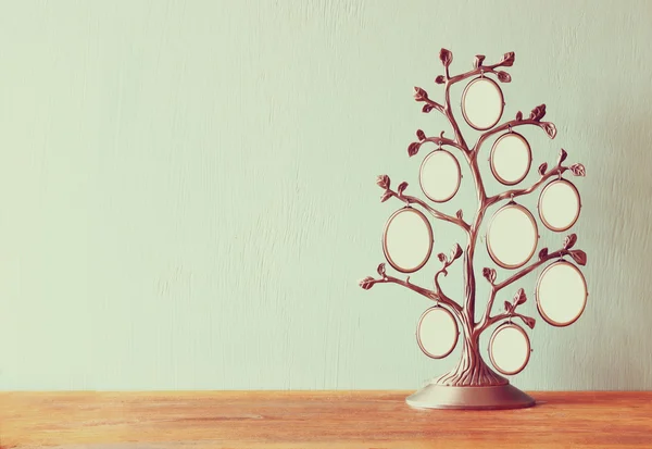 Image of vintage antique classical frame of family tree on wooden table — Stock Photo, Image