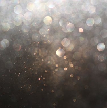 Glitter vintage ışıklar arka plan. Altın, gümüş ve siyah. de-odaklı.