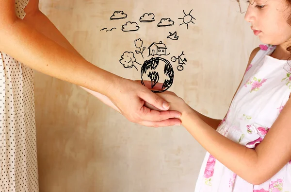 Photo of mother and child holding hands and showing a better world concept with set infographics . protection and education concept — Stock Photo, Image