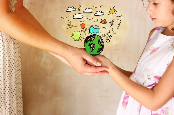 Photo of mother and child holding hands and showing a better world concept with set infographics . protection and education concept — Stock Photo, Image