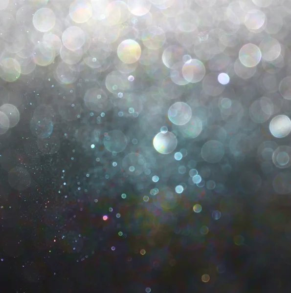 Glitter vintage lights background. gold, silver, blue and black. de-focused. — Stock Photo, Image