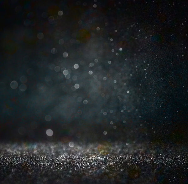 Блестящие винтажные огни фона. золото, серебро, синий и черный. de-focused
.