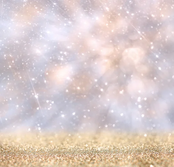 Glitter vintage lights background. gold, silver, and white. de-focused. — Stock Photo, Image