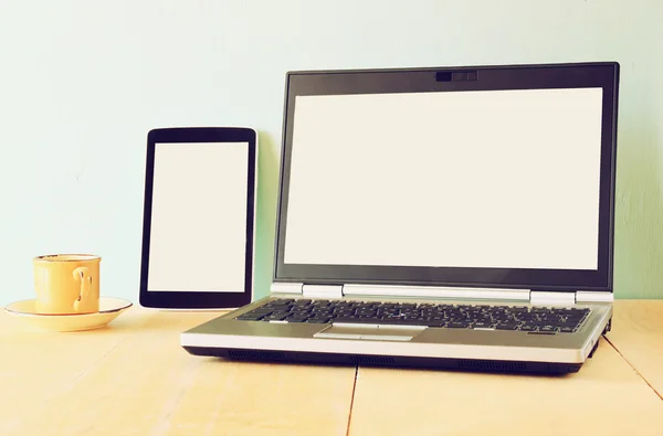 Top view of tablet device and laptop with blank screen ready for mock up — Stock Photo, Image