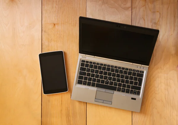 Top view of tablet device and laptop with blank screen ready for mock up — Stock Photo, Image