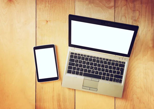 Top view of tablet device and laptop with blank screen ready for mock up — Stock Photo, Image