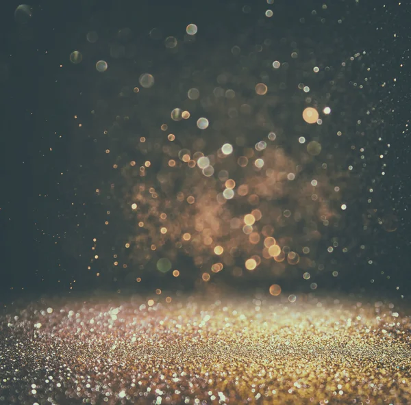 Glitter vintage ışıklar arka plan. ışık altın rengi ve siyah. defocused.