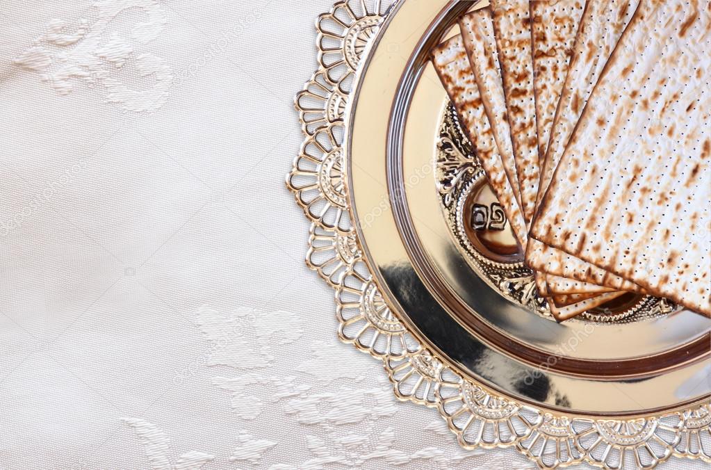 Top view of passover background. matzoh (jewish passover bread) and traditional sedder plate over wooden table