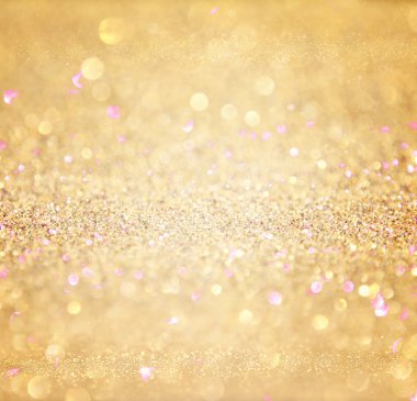 Glitter vintage lights background. abstract gold background . defocused clipart