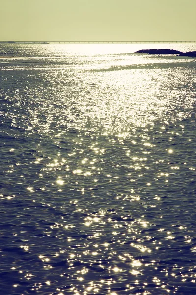 Background of sunset and sea waves. filtered image — Stock Photo, Image