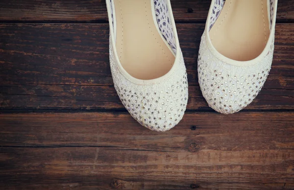 Girl shoes over wooden deck floor. filtered image. — Stock Photo, Image