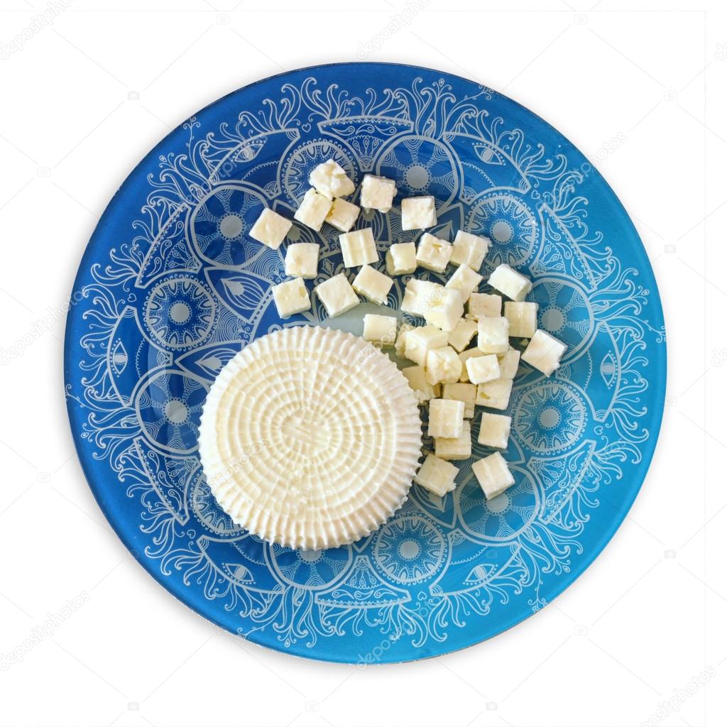 Top view of greek cheese and bulgarian cheese on wooden table over wooden textured background. Symbols of jewish holiday - Shavuot . isolated on white