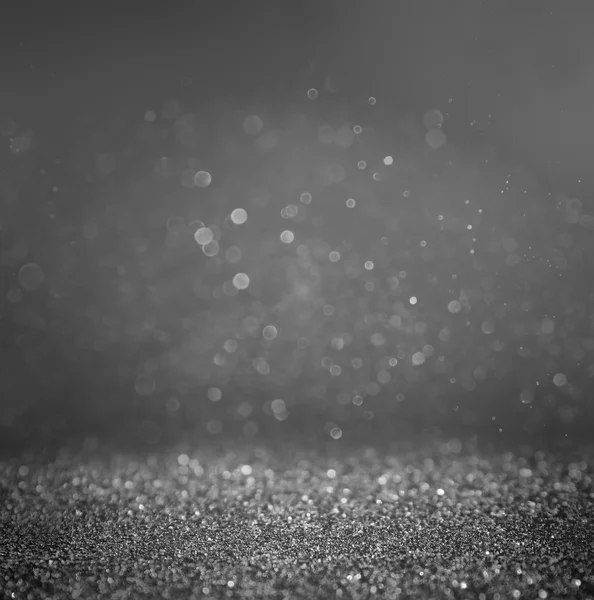 Dark glitter vintage lights background. light silver and black. defocused. — Stock Photo, Image