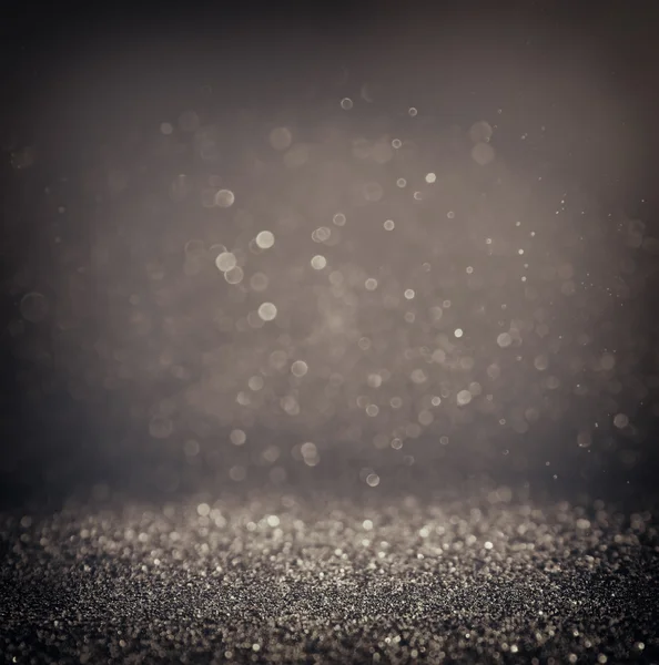 Scuro glitter vintage luci di sfondo. argento chiaro e nero. sfocato . — Foto Stock
