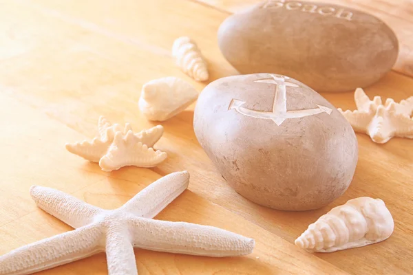 Close up of collection of nautical and beach objects  over wooden background — Stock Photo, Image