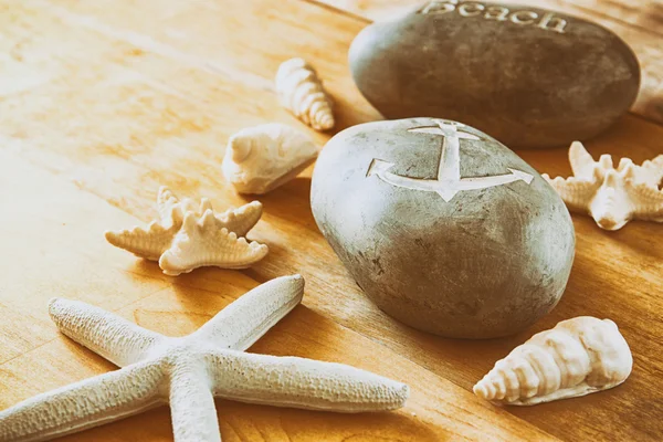 Close up of collection of nautical and beach objects  over wooden background — Stock Photo, Image