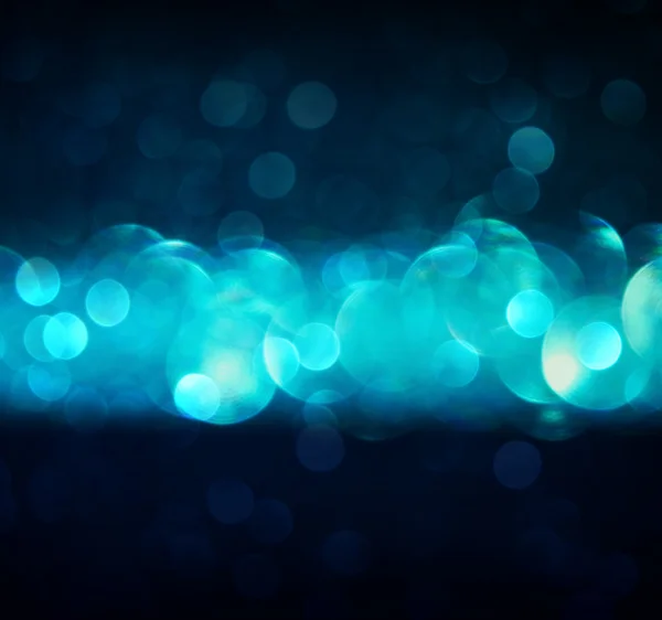 Glitter vintage lights background. gold, silver, blue and black. de-focused. — Stock Photo, Image