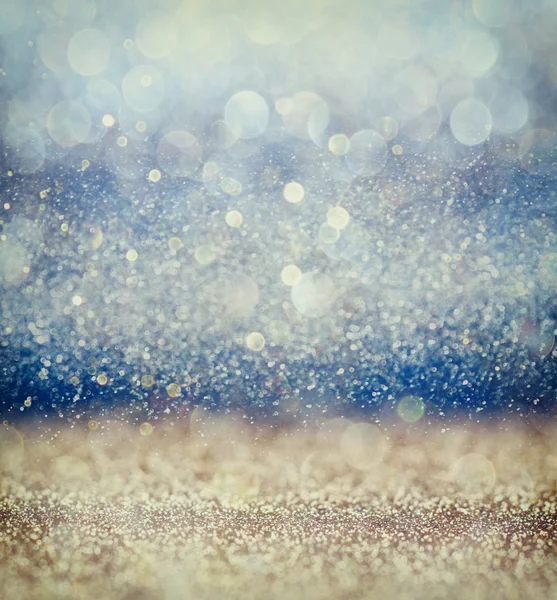 Glitter vintage lights background with light burst . silver, blue and white. de-focused. — Stock Photo, Image