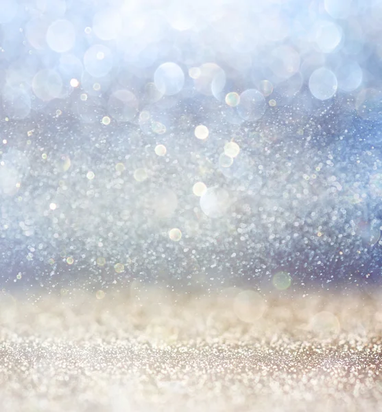 Glitter vintage lights background with light burst . silver, blue and white. de-focused. — Stock Photo, Image